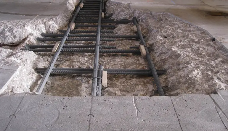 Exposed rebar during structural concrete restoration by Concrete Rotorua concrete repairs specialists.